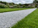 Bonded gravel garden path with crisp lawn edge after applying Pro-Hold gravel glue